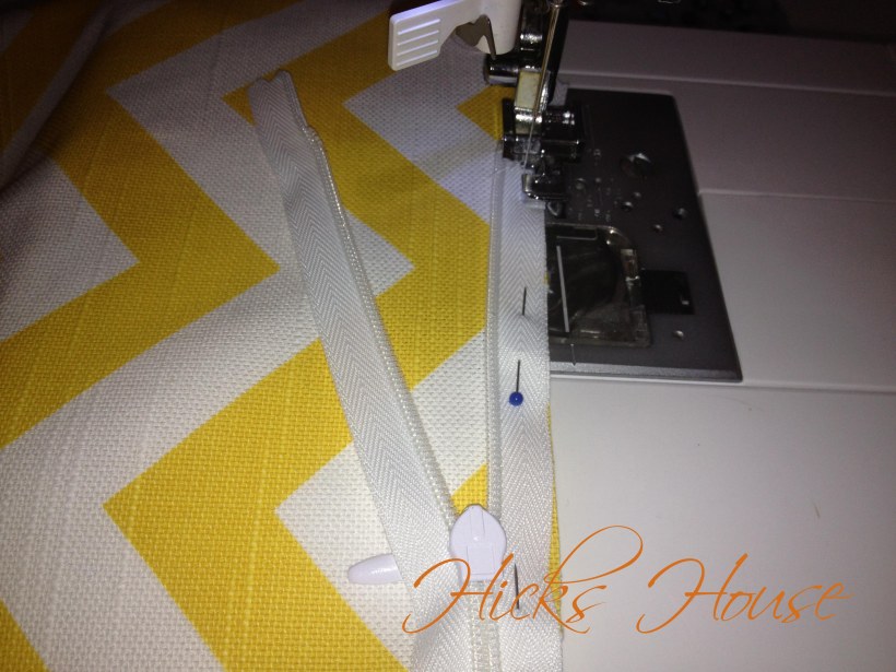 attach the first side of the zipper